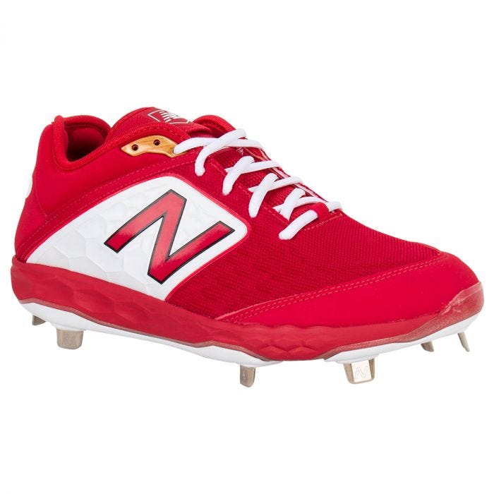 white and red new balance cleats