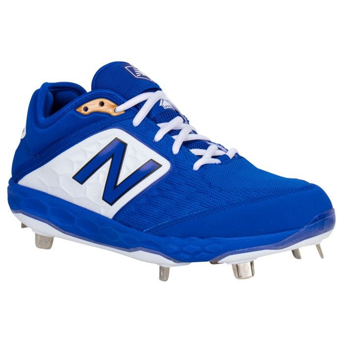 blue and white new balance cleats